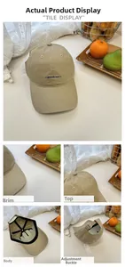 Detail view of khaki baseball cap with embroidery and adjustable metal buckle strap