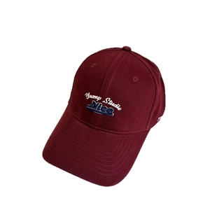 Retro maroon baseball cap with Yump Studio embroidery and curved brim for men and women