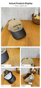 Close-up of the bear embroidery and contrast leather brim of this baseball cap