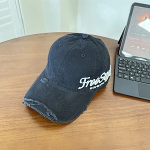 Black distressed denim baseball cap with freestyle embroidery and vintage ripped details