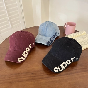 Distressed baseball caps with 'super 90' embroidery in burgundy, denim blue, and black colors