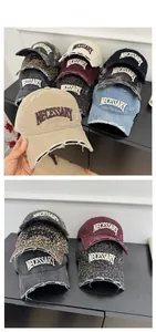 Macro detail of vintage baseball cap featuring distressed holes and NECESSARY 3D embroidery