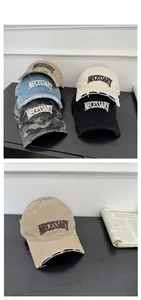 Detail of vintage baseball cap featuring distressed brim and NECESSARY letter embroidery