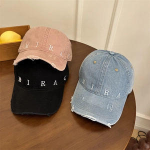 Distressed vintage baseball caps with MIRAC embroidery in black, purple and denim blue