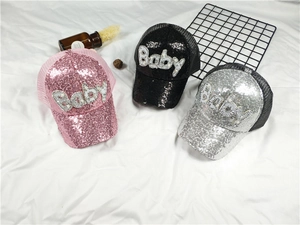 Detail showing glittery Baby letter caps in pink, black, and silver with mesh panels