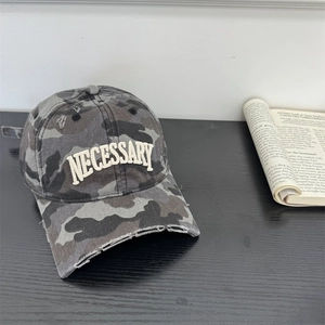 Street style camo baseball cap with NECESSARY embroidery and distressed brim detail