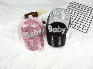 Detail of sequined baseball caps with Baby pearl lettering and breathable mesh back