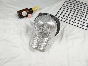 Close-up of baby sparkling silver sequin baseball cap with pearl and rhinestone lettering
