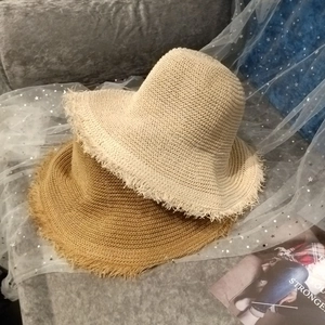 Women's wide brim straw sun hats with frayed edges in beige and khaki styles