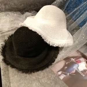 Women's woven straw sun hat with raw fringe brim for summer beach UV protection