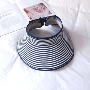 Foldable navy and white striped straw sun hat with a wide brim for summer beach protection