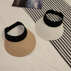 Women's foldable straw sun visor hat with wide brim for UV protection in beige and white
