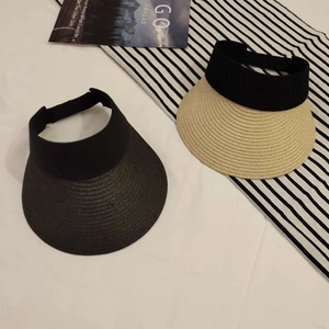Women's foldable straw visor hats for sun protection featuring a black elastic headband