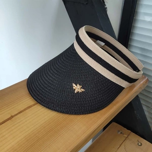 Women's black straw open top sun hat with striped ribbon and golden bee ornament