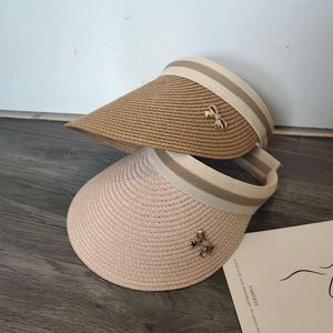 Women straw sun visor hats with bowknot detail in beige and pink for beach summer style