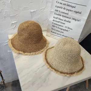 Handmade woven straw sun hat with frayed brim edge in beige and coffee colors