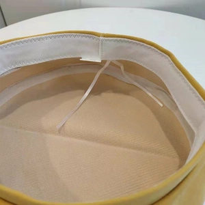 Detail view of cotton beret interior showing white sweatband and adjustable drawstring