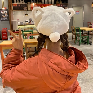 Rear view of white plush beret with cute ears and fluffy tail for winter fashion