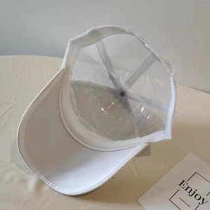 Detailed view of white mesh baseball cap interior with plastic support insert