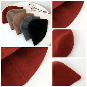 Detail shots of wool felt bucket hats showing fine stitching and classic autumn colors