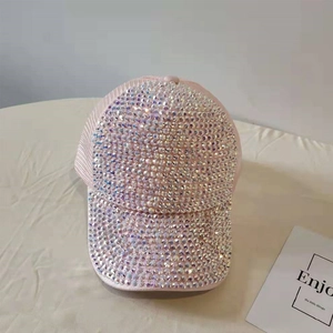 Detail of pink trucker hat featuring shimmering rhinestones and breathable mesh panels