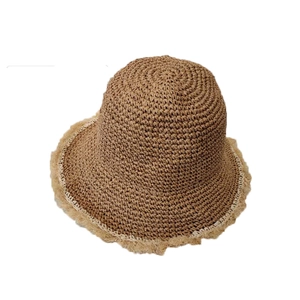 Handwoven straw bucket hat in brown with stylish frayed edges for summer sun protection