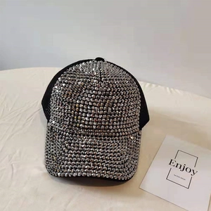 Detail of black breathable mesh baseball cap with shiny silver rhinestone embellishments