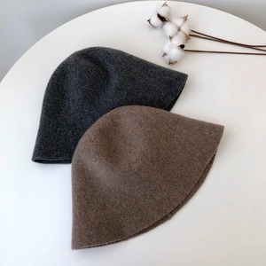 Foldable knitted wool bucket hats in grey and camel colors for autumn and winter seasons