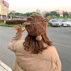 Detailed back view of a brown plush beret with cute 3D animal ears for winter fashion