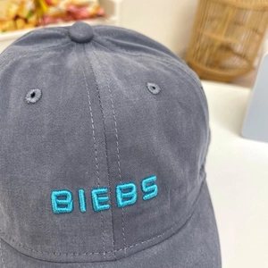 Detail of teal BIEBS embroidery on vintage grey washed cotton baseball cap