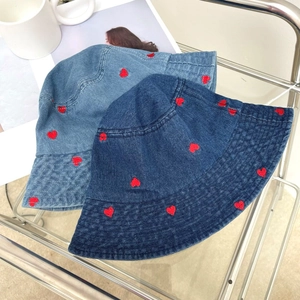 Denim bucket hat with red heart embroidery in light and dark blue wash denim