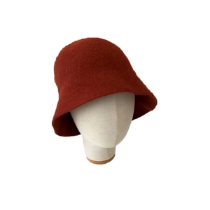 Deep rust red wool felt cloche bucket hat for women on white model head display