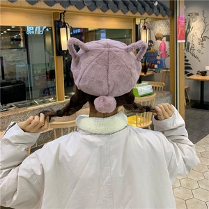 Macro shot of fluffy lavender faux fur beret with cute 3D ears and pompom detail