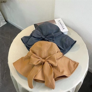 Chic striped cotton linen sun hat with oversized bow decoration for women