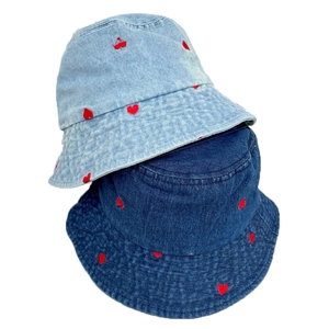 Denim bucket hat with red heart embroidery in light and dark blue wash styles