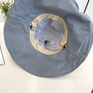 Detail view of cotton sun hat showing breathable mesh lining and adjustable chin strap