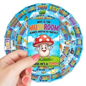 Close-up of children's lunchbox joke cards featuring colorful illustrations and puns