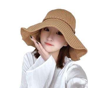 Women's brown striped sun hat with wide brim and decorative woven band for sun protection