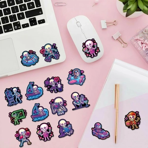 Close-up of neon purple skull stickers with creative lifestyle themes on a laptop