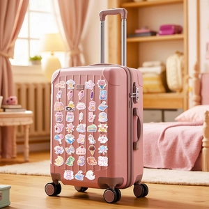 Cute pink candy stickers pack applied on a suitcase in a cozy bedroom setting