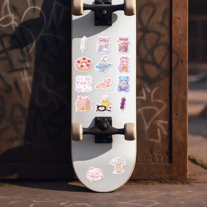 Close-up of cute pink candy and animal stickers applied on a white skateboard deck