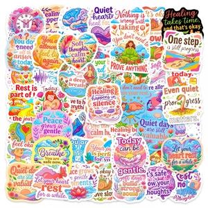 Flat lay of colorful waterproof mental health stickers with positive English quotes