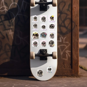 Detailed view of waterproof funny hamster stickers applied to a white skateboard deck