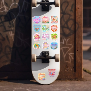Waterproof mental health stickers with inspirational quotes on a white skateboard