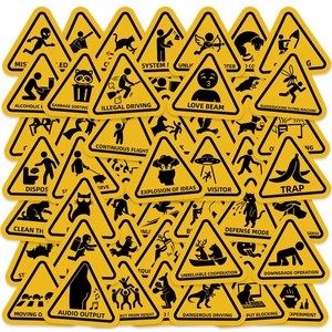 Macro view of various humorous yellow warning stickers with creative stickman icons