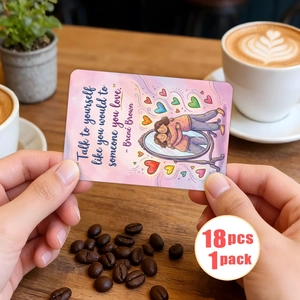 Detailed view of positive affirmation cards in hands with soft watercolor design and quotes