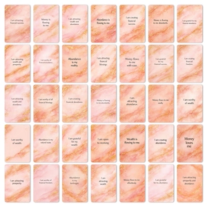 Set of 36 pink marble affirmation cards with gold accents for financial success and manifesting