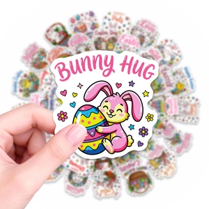 Close-up of hand holding a Bunny Hug Easter sticker with waterproof cartoon rabbit decals