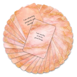 Symmetric circular layout of pink marble affirmation cards with gold glitter accents