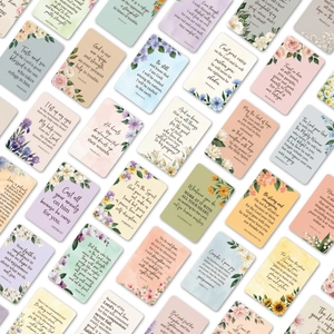 Close-up of assorted watercolor floral cards with inspirational English bible verses